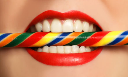 Healthy teeth biting on candy cane